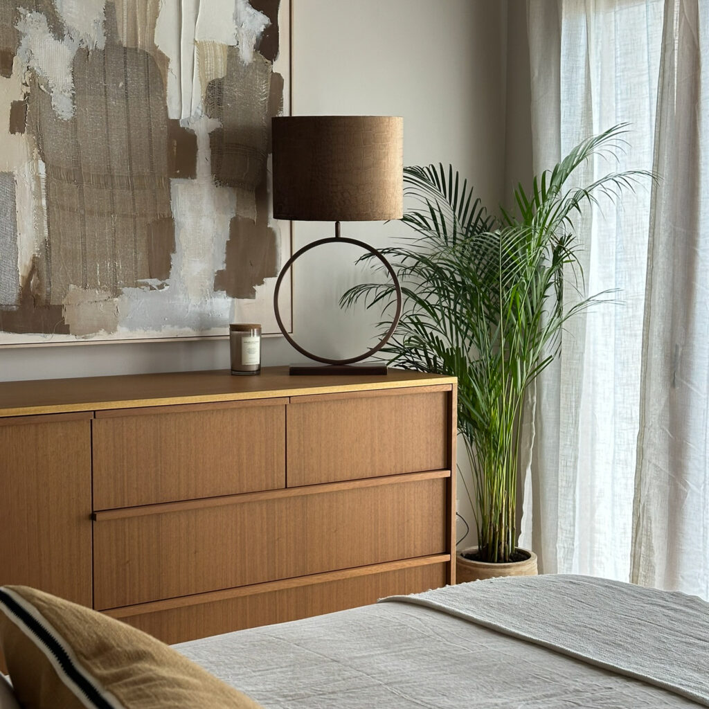 Bespoke chest of drawers in iroko wood, with Light & Living lamp, Vical wall art. Farrow & Ball Schoolhouse White paint on the walls.