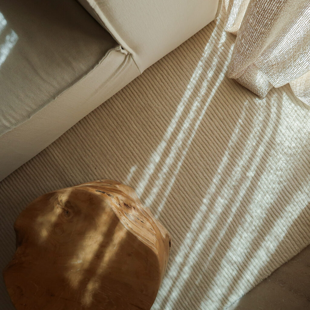 Sitting room details with Alhambra fabric curtains and Nordic Knots wool rug.
