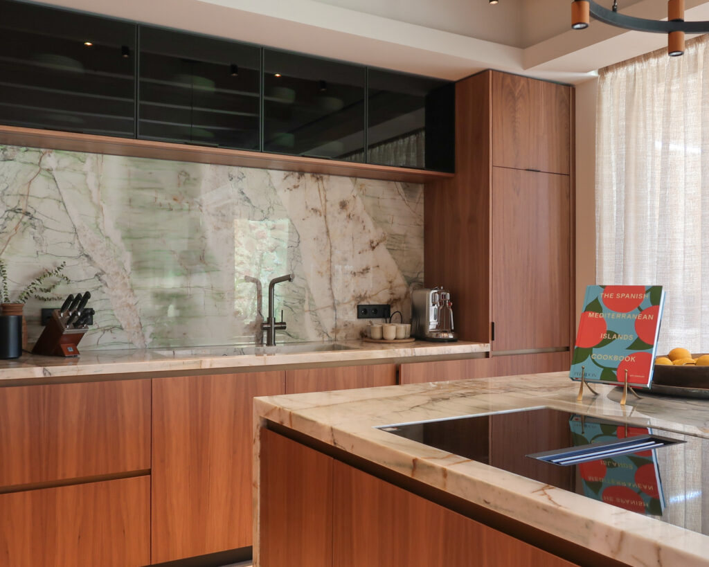 Bespoke kitchen design in walnut & quartzite worktops. Miele appliances. Antique brass detailing from Lost Cowboys in The Netherlands.